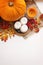 Autumn composition of pumpkins, leaves, berries and candles