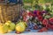 Autumn composition with ripe apples, wicker basket with grapes r