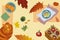 Autumn composition yellow red green leaves box with apples ginger cat donuts buns cozy atmosphere top view