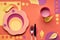 Autumn concept flat lay in bold colors with plate, fork, knife and decorative Autumn leaves