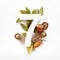 Autumn concept. Number seven shape with autumn leaves, acorns and fearhers. Nature concept. Flat lay. Top view