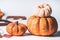 Autumn concept. Various pumpkins on white background with fall leaves, front view. Harvest vegetables , Thanksgiving food