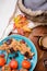 Autumn cozy composition with ripe persimmons and cookies at wooden table. life style concept. flat lay