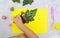 Autumn crafts. Child making butterfly from natural cone and leaves use paper and plasticine. Back to school. Ideas for children`s