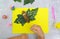 Autumn crafts. Child making fun butterfly from natural cone and leaves use paper and plasticine. Back to school. Ideas for