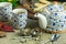 Autumn cup of tea with teapot on a rustic table.