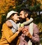 Autumn dating and English tea time. Girl and bearded guy