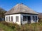 An autumn day, a mountain chalet, a sunny morning, the life of wooden structures, residential buildings falling into disrepair.