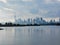 Autumn day view across inner bays of Lake Ontario in Tommy Thompson Park with foggy Downtown Toronto skyline under grey