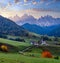 Autumn daybreak Santa Magdalena famous Italy Dolomites village view in front of the Geisler or Odle Dolomites mountain rocks.