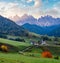 Autumn daybreak Santa Magdalena famous Italy Dolomites village view in front of the Geisler or Odle Dolomites mountain rocks.