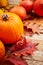 Autumn decor from pumpkins, berries and leaves on a white  wooden background. Concept of Thanksgiving day or Halloween. Flat lay