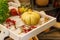 Autumn decoration pumpkin, nuts, apples on a wooden table. Thanksgiving card creation for fall and autumn concepts