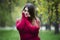 Autumn depression, young beautiful caucasian plus size model in red pullover outdoors, xxl woman on nature, fall atmosphere