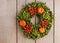 Autumn door wreath on wooden background