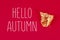 Autumn dry leaves painted with gold paint on red background. Top view. Trendy. Golden autumn