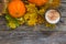 Autumn fall background. Leaves, pumpkins, mug of coffee latter on the vintage wooden board desk , top view. Copy space
