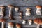 Autumn fall composition. Variety raw edible mushrooms Penny Bun Boletus leccinum on rustic table. Ceps over wooden dark background