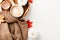 Autumn, fall concept. Flat lay brown sweater, cup of coffee, pumpkins, maple leaves on white desk table, top view