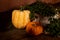 Autumn Fall Halloween Pumpkins dark moody magical forest green plants on wooden tabl