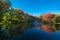 Autumn fall landscape reflected on the water in Bucks County, Pennsylvania, USA.