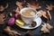 Autumn, fall leaves, hot steaming cup of cappuccino coffees, macaroons, cones on wooden table background.