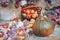 Autumn fall seasonal decorations with pumpkins, fresh fruits in basket, berries and flowers. Autumn harvest, farm market, sale