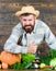 Autumn on the farm. man chef with rich autumn crop. organic and natural food. happy halloween. bearded mature farmer