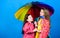 Autumn fashion. family bonds. Little girls in raincoat. rain protection. Rainbow. cheerful hipster children, sisterhood