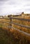 Autumn, fence and old western farm buildings