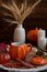 Autumn festive decor on the table with a cup of hot drink, still life.