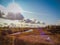 Autumn field river sky clouds bright sunlight grass