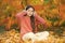 Autumn is finally here. Special instrumental music collection for total relax. Kid girl relaxing near autumn tree with
