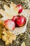 Autumn flatley. Apples with yellow leaves in a wicker eco basket.