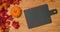 Autumn foliage with a pumpkin and a blackboard