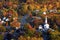 Autumn foliage surrounds a quaint New England town