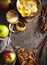 Autumn food background with apples, spices and nuts. Ingredients