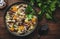 Autumn food. Warming soup with pumpkin, mushrooms, vegetables, beef and barley. Rustic wood table background, top view