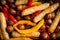 Autumn foodie: grilled sausages with pumpkin slices, potato and bell pepper on the wooden background