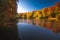 Autumn in the forest. Fall scene with forest lake in Hungary. Long exposure shot.