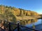 Autumn forest on river bank