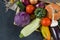 autumn fresh vegetables, pumpkins, tomatoes, cabbage, zucchini, onions, eggplant , dry fallen leaves, cucumber, garlic,