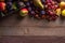 Autumn fruit assortment on wooden background