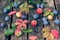 Autumn fruits on an old wooden background. Plum, apples and red leaves of grapes