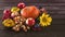 Autumn fruits and vegetables background. Harvest of ripe apples, grapes, plums, nuts and pumpkins, sunflower flowe