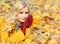 Autumn Girl. Fashion Blonde Beautiful Woman with Maple leaves in