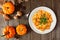 Autumn gnocchi with a pumpkin cream sauce, above table scene over wood