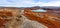 Autumn greenlandic orange tundra landscape with lakes and mountains in the background, Kangerlussuaq