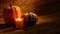 Autumn harvest candles and Embroidered Pumkins on retro wood background video