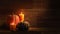 Autumn harvest candles and Embroidered Pumkins on retro wood background video